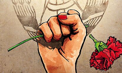 Das Bild zeigt einen Auschitt des Filmplakats zu dem Film 'Die Unbeugsamen 2 - Guten Morgen, Ihr Schönen!'. Zu sehen ist eine Hand, die aus dem unteren Rand erwächst und wagerecht eine rote Blume hält. Der Kopf der Blume fällt gerade ab. Im Hintergrund ist das Wappen der DDR zu sehen.