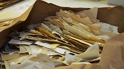 Hand-torn documents in the Stasi Records Archive., Source:
                                                BStU